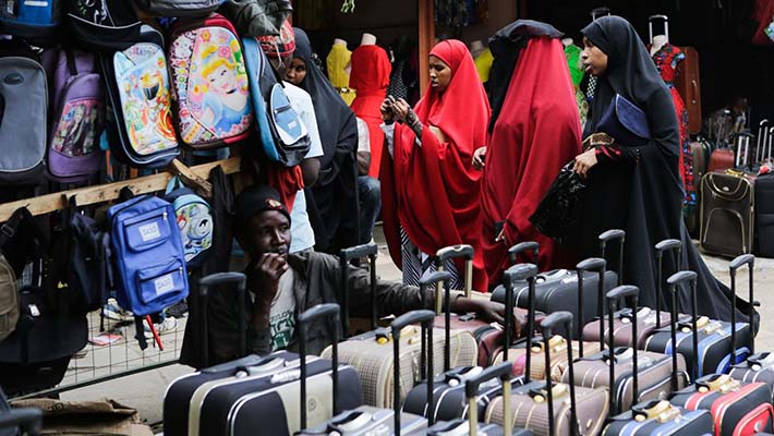 women in eastleigh browse a shop selling jewelry and suitcases e1493754595461